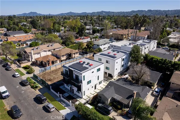 a view of a house with a mountain in front of it