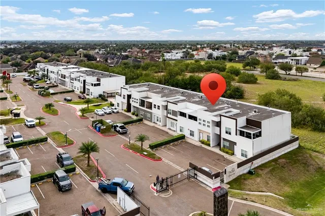 an aerial view of a house with outdoor space