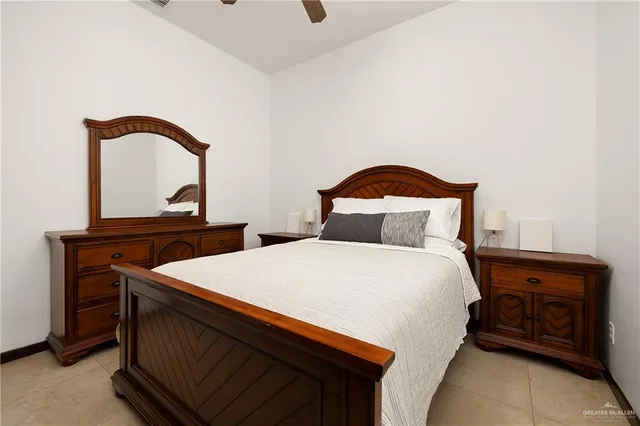 a bedroom with a bed and a dresser