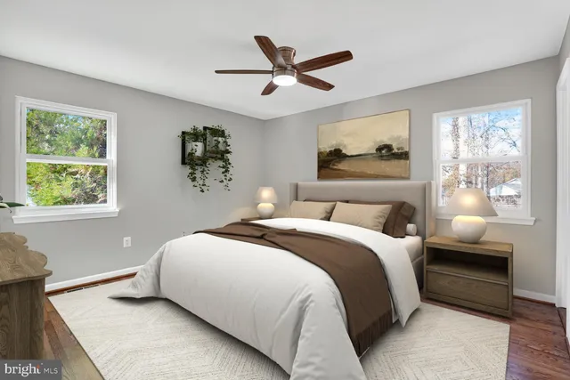 a bedroom with a large bed and a flat screen tv