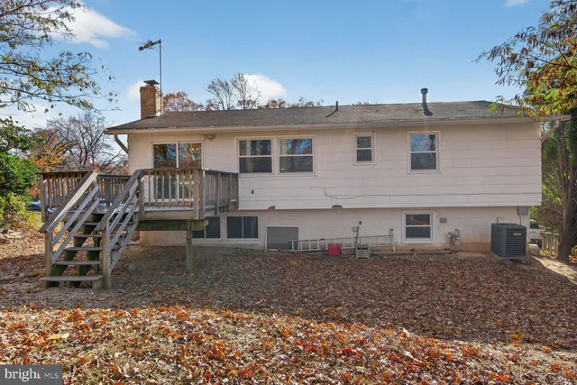a view of a house with a yard and furniture
