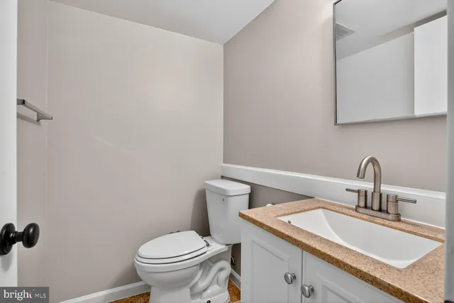 a view of a workspace with furniture and a workspace