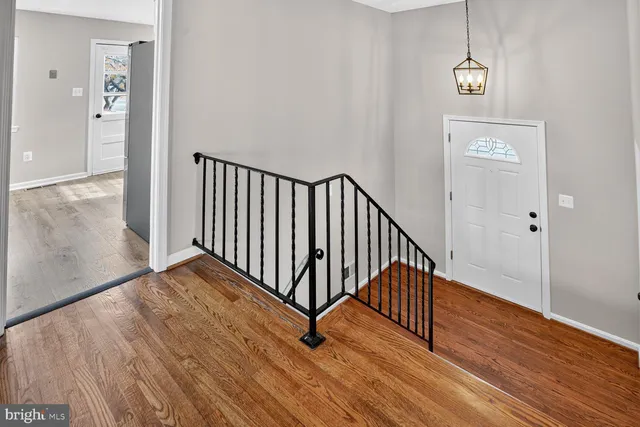 a kitchen with stainless steel appliances a refrigerator sink and cabinets