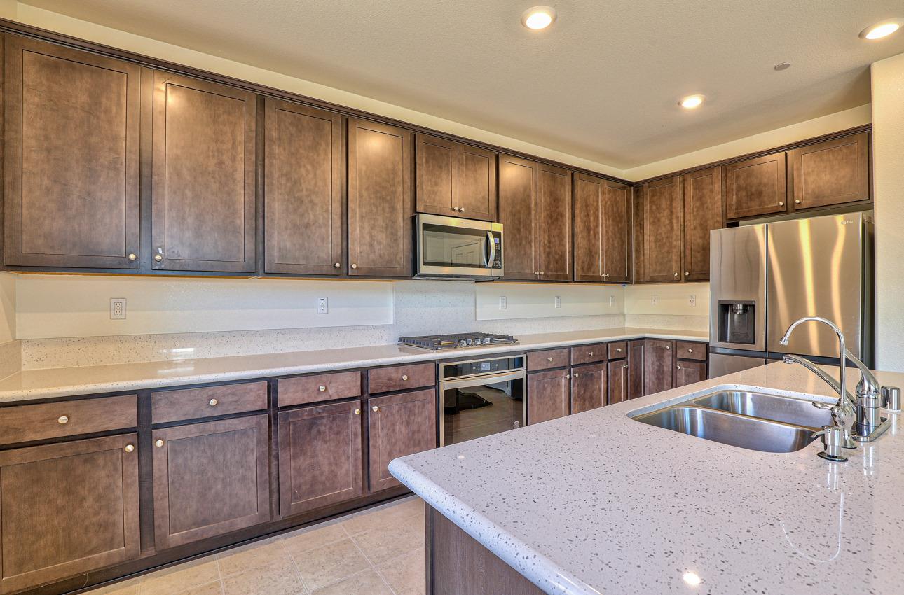 1400 Winzer Place Gilroy, CA 95020 - Photo 16 of 33 a kitchen with stainless steel appliances granite countertop a sink refrigerator and microwave