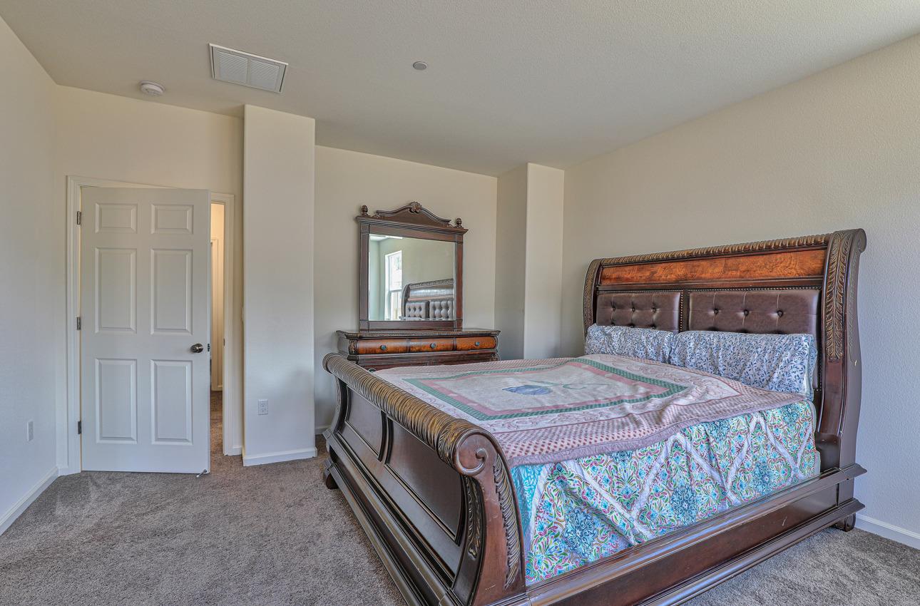 1400 Winzer Place Gilroy, CA 95020 - Photo 20 of 33 a bedroom with a bed and a mirror on dresser