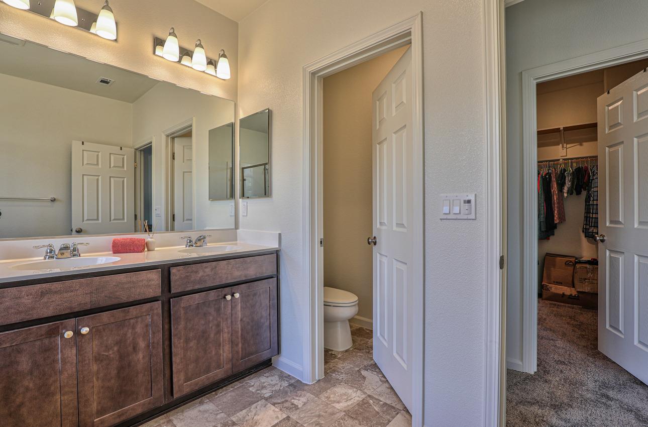 1400 Winzer Place Gilroy, CA 95020 - Photo 24 of 33 a bathroom with a double vanity sink and a mirror