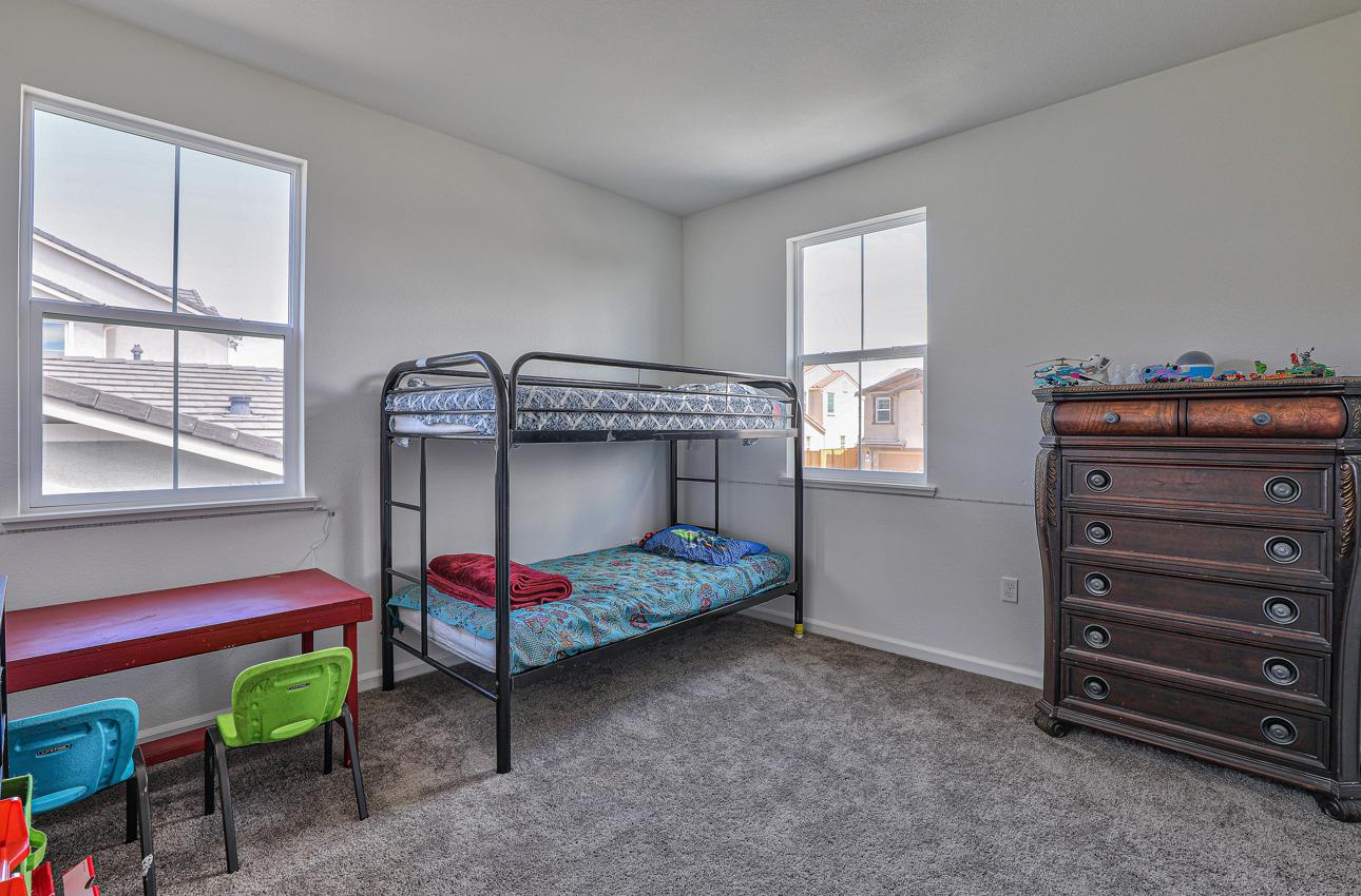 1400 Winzer Place Gilroy, CA 95020 - Photo 27 of 33 a bedroom with a bed and a window