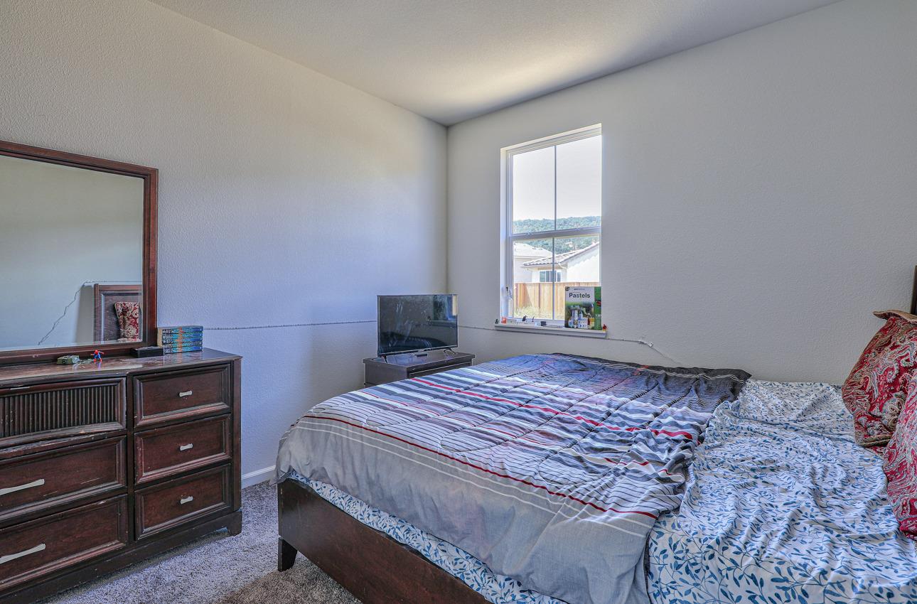 1400 Winzer Place Gilroy, CA 95020 - Photo 30 of 33 a bedroom with a bed and a dresser in it