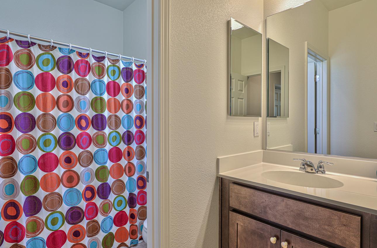 1400 Winzer Place Gilroy, CA 95020 - Photo 32 of 33 a bathroom with a sink mirror and vanity