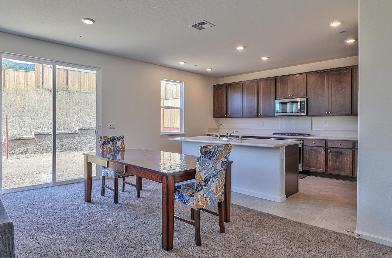 1400 Winzer Place Gilroy, CA 95020 - Photo 10 of 33 a kitchen with a table chairs sink and cabinets