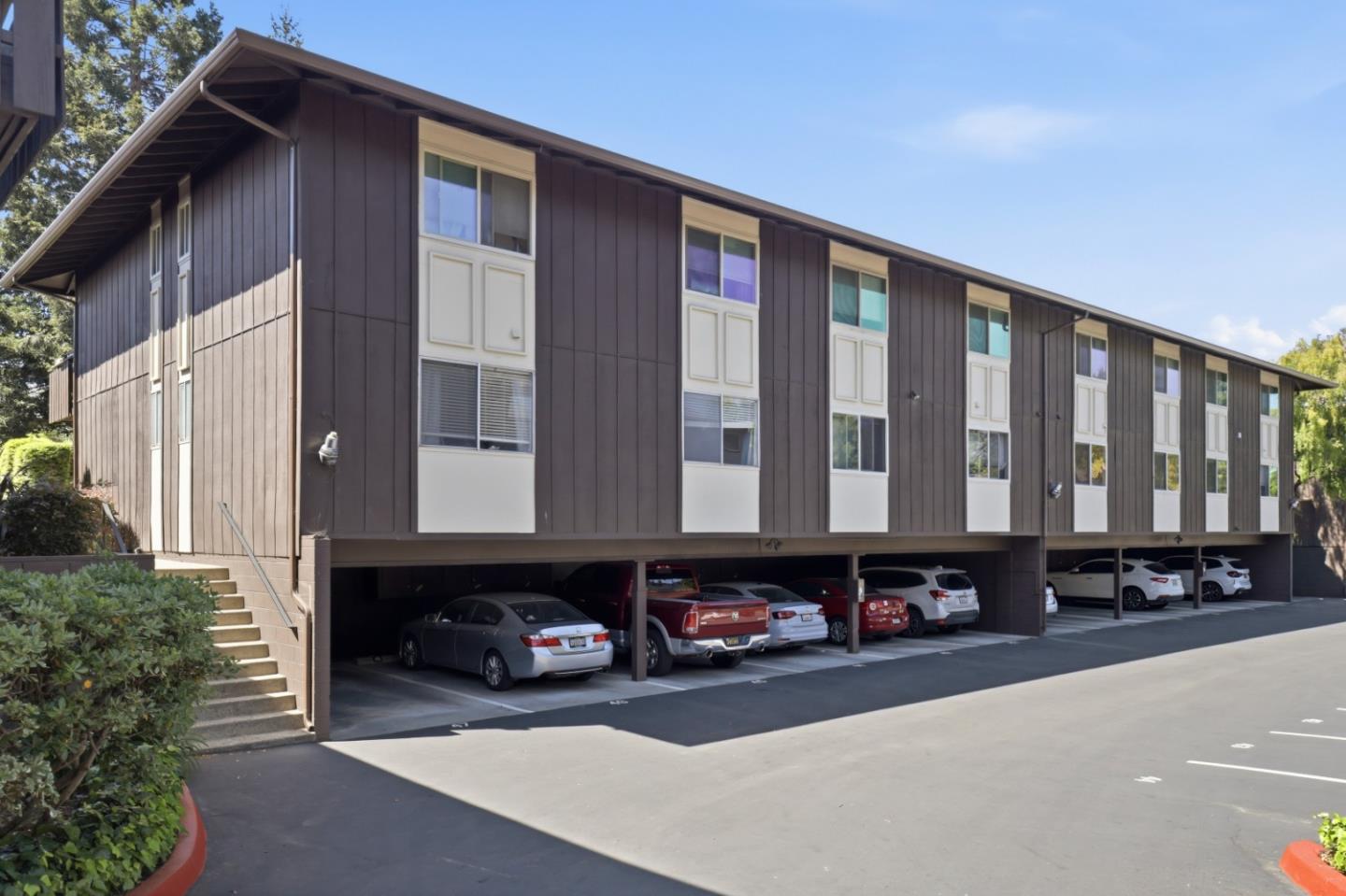 100 East Middlefield Road, Unit 3B Mountain View, CA 94043 - Photo 23 of 32 a front view of a building with glass windows and a street