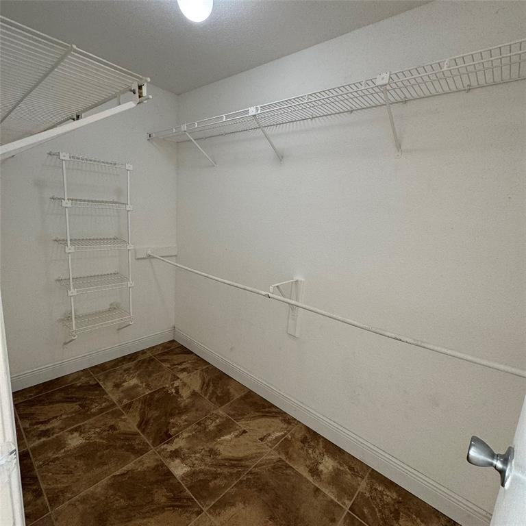 805 Riverside Drive, Unit 1112 Coral Springs, FL 33071 - Photo 12 of 26 a view of a room with racks on the wall