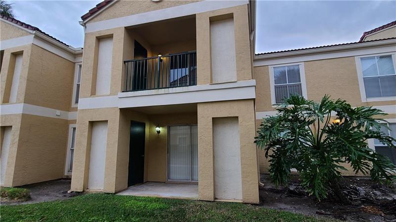 805 Riverside Drive, Unit 1112 Coral Springs, FL 33071 - Photo 20 of 26 front view of a house with a yard