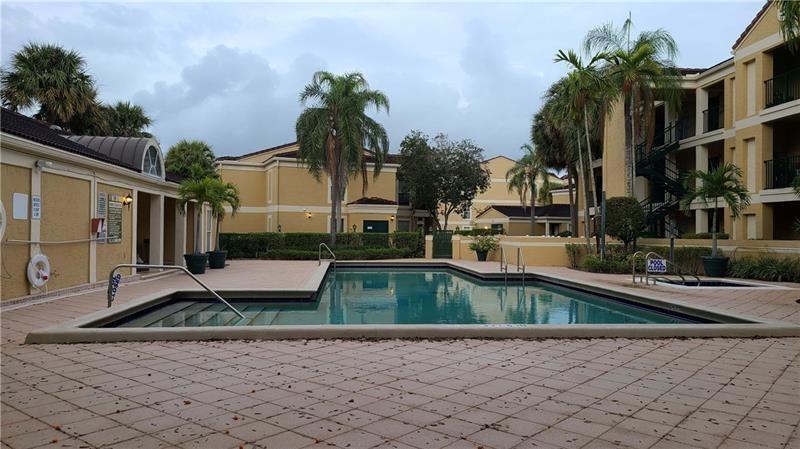 805 Riverside Drive, Unit 1112 Coral Springs, FL 33071 - Photo 26 of 26 a view of a house with backyard fountain and sitting area