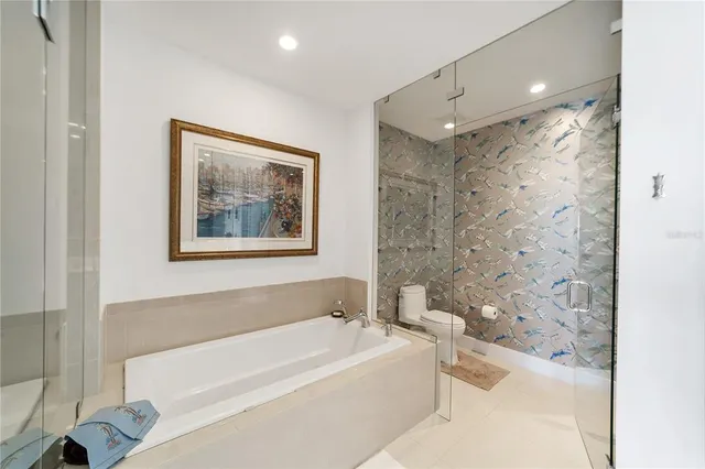 a bathroom with a bathtub and a shower