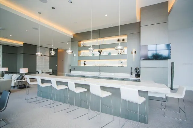 a large kitchen with a table and chairs