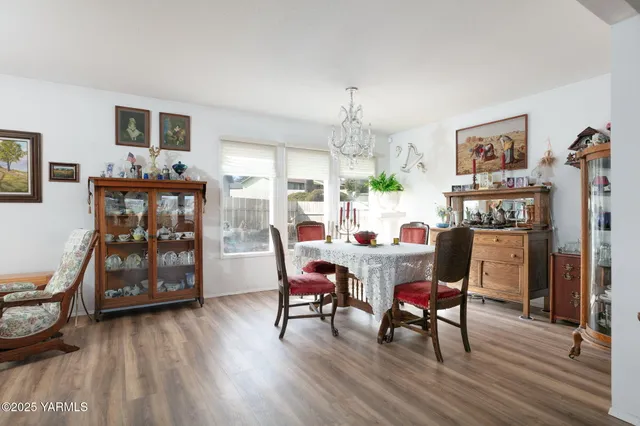 a dining room with furniture and wooden floor