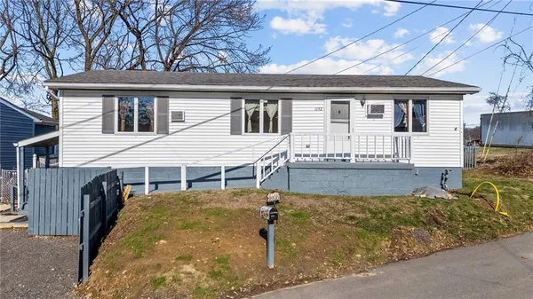 front view of a house with a yard
