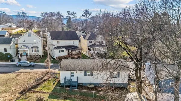 a view of multiple houses with a yard