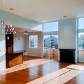 a living room with fireplace furniture and a wooden floor