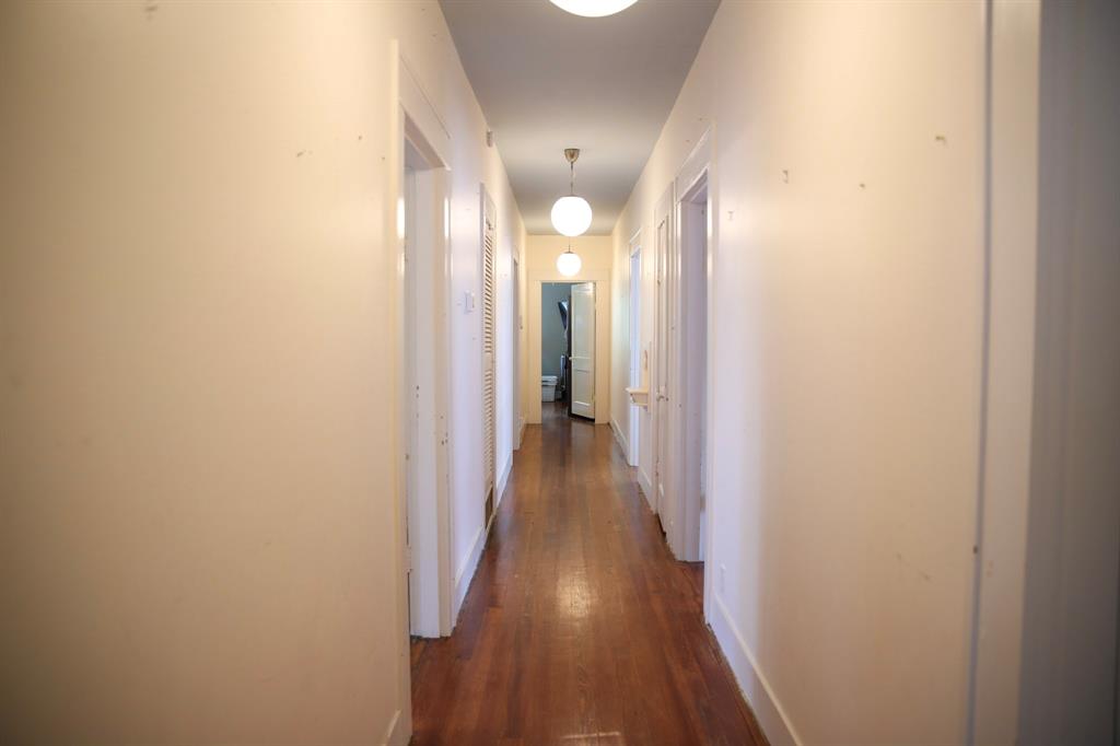 1500 Bonham Street Commerce, TX 75428 - Photo 25 of 29 a view of a hallway with wooden floor