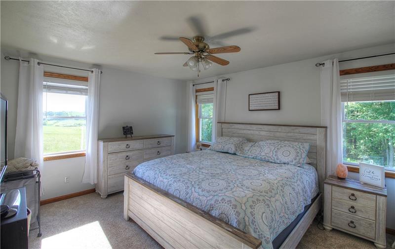 132 Rieger Road Butler, PA 16001 - Photo 10 of 25 The windows in the master bedroom let nature in. The favorite view of neighboring farmland and incredible sunsets is out the window to the left. The windows on the back side overlook the woods.