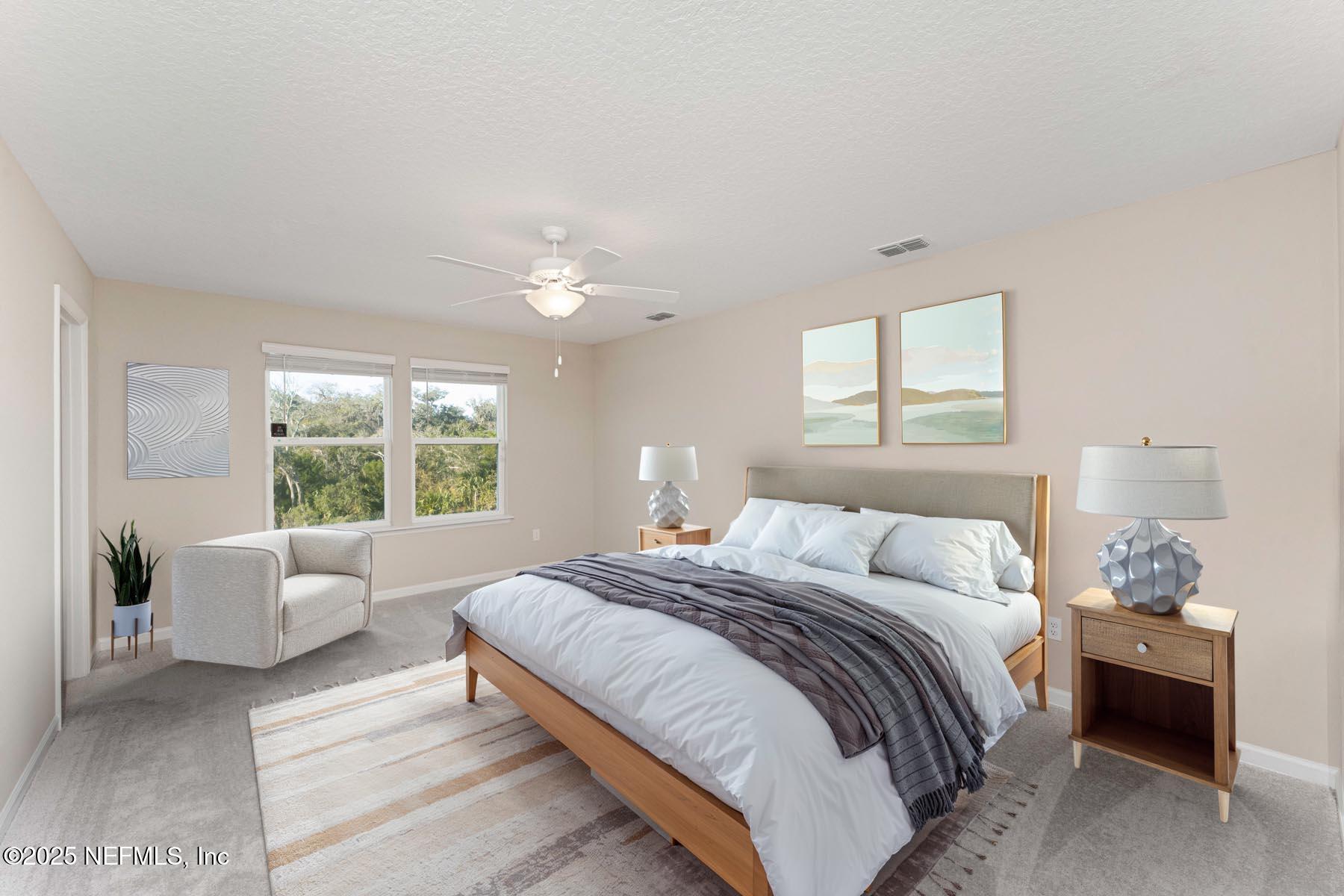 1171 Beach Dune Drive Jacksonville, FL 32233 - Photo 8 of 27 a bedroom with a bed and a couch