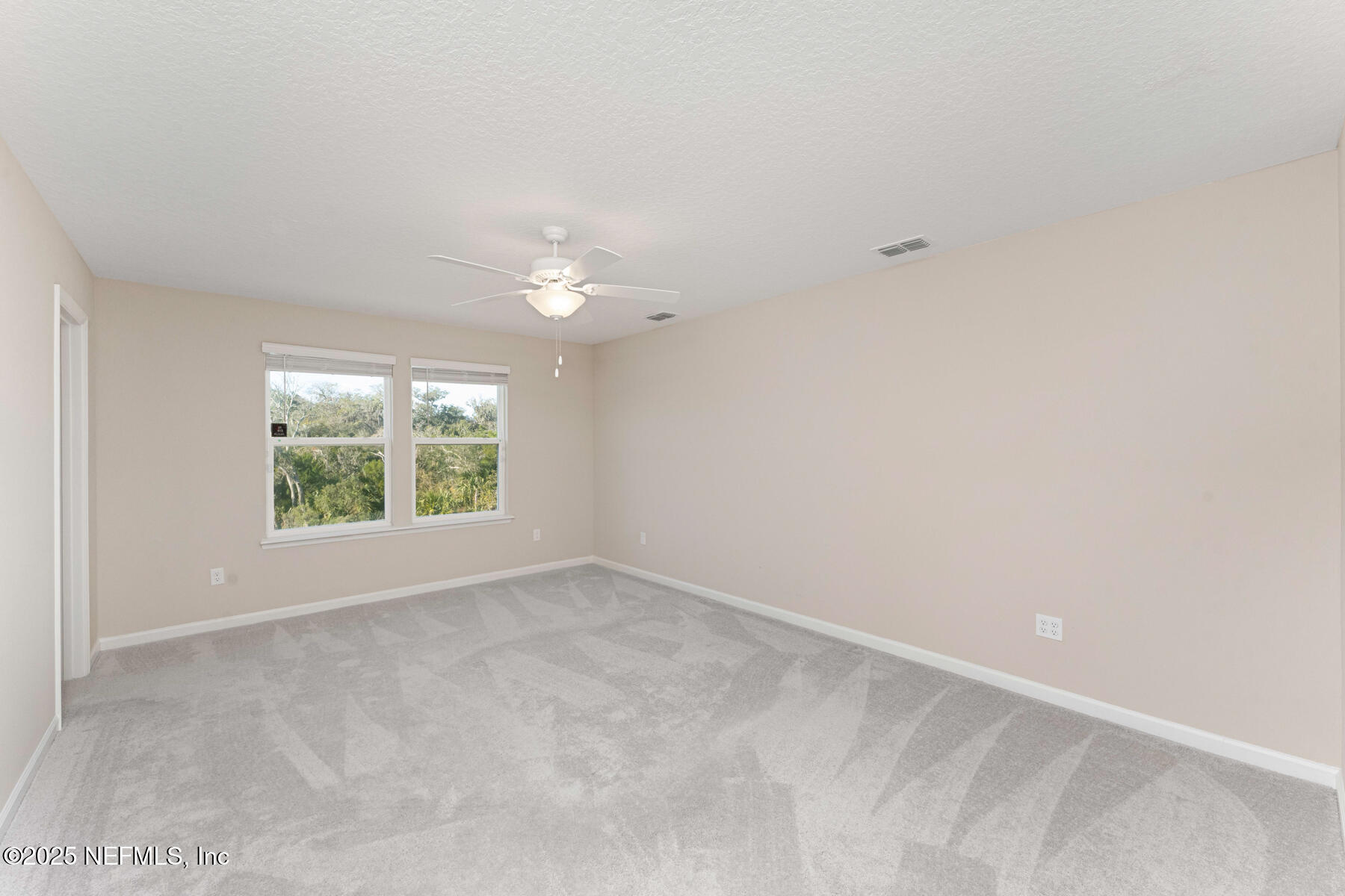 1171 Beach Dune Drive Jacksonville, FL 32233 - Photo 9 of 27 an empty room with windows