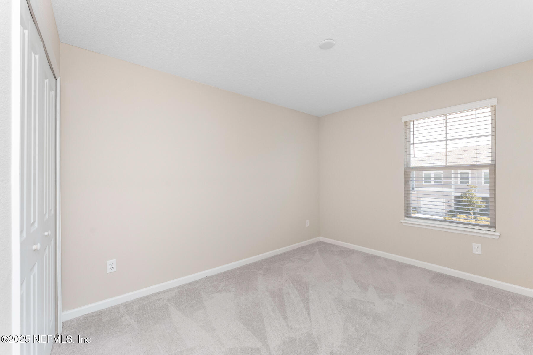 1171 Beach Dune Drive Jacksonville, FL 32233 - Photo 14 of 27 an empty room with a window