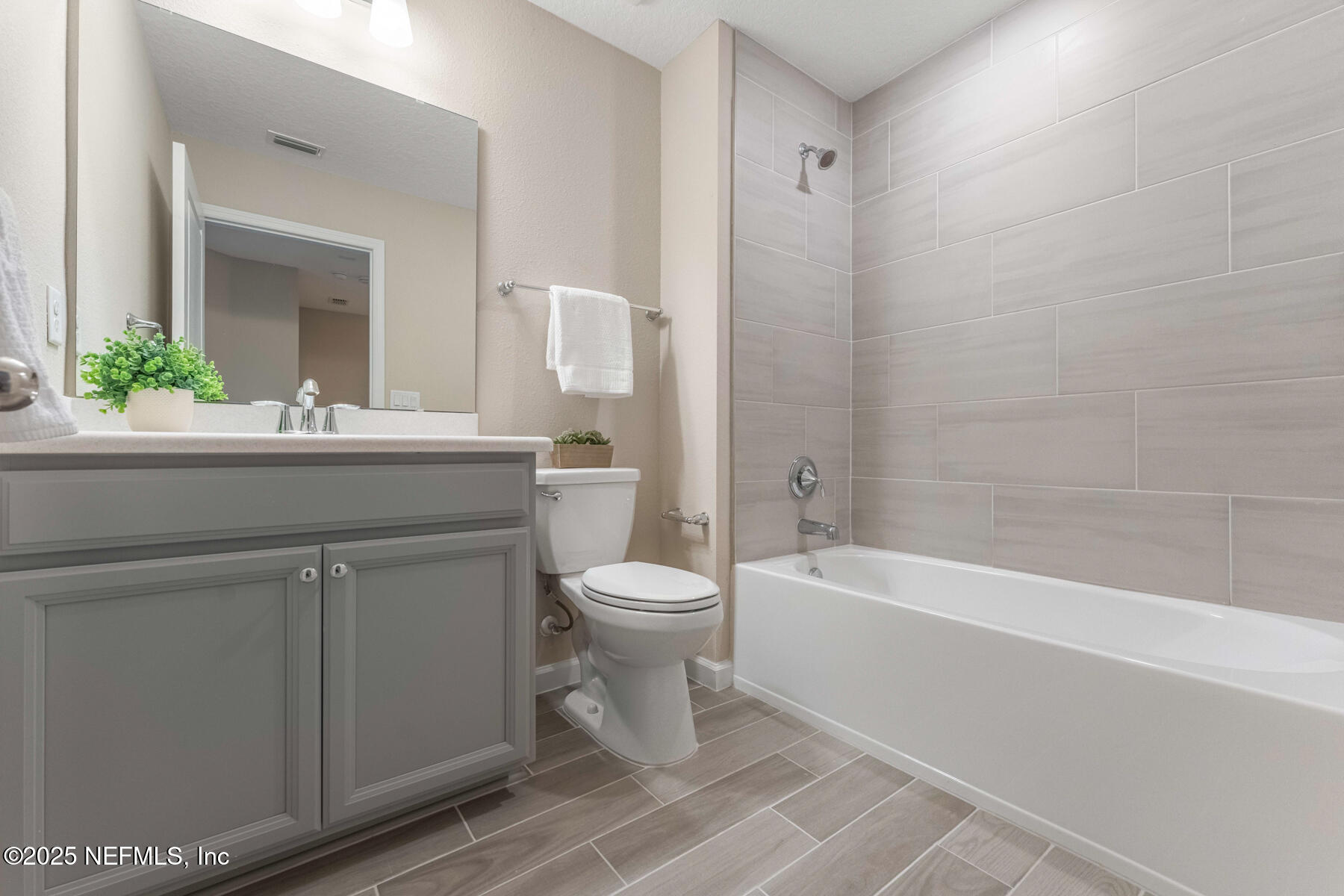 1171 Beach Dune Drive Jacksonville, FL 32233 - Photo 15 of 27 a bathroom with a sink a toilet and shower