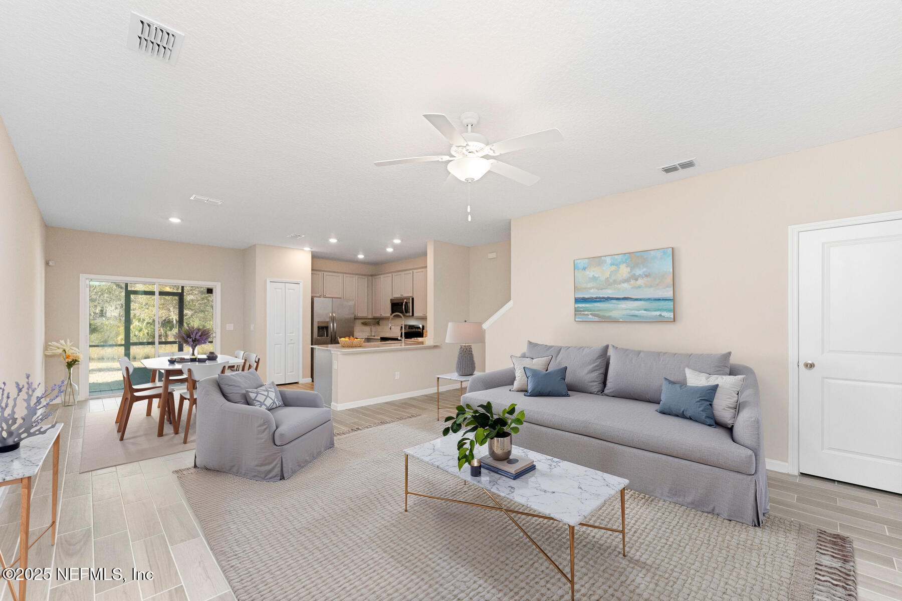 1171 Beach Dune Drive Jacksonville, FL 32233 - Photo 25 of 27 a living room with furniture kitchen view and a table