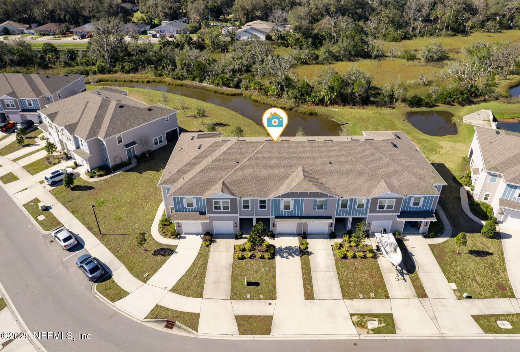 1171 Beach Dune Drive Jacksonville, FL 32233 - Photo 23 of 27 an aerial view of a house with swimming pool and outdoor seating