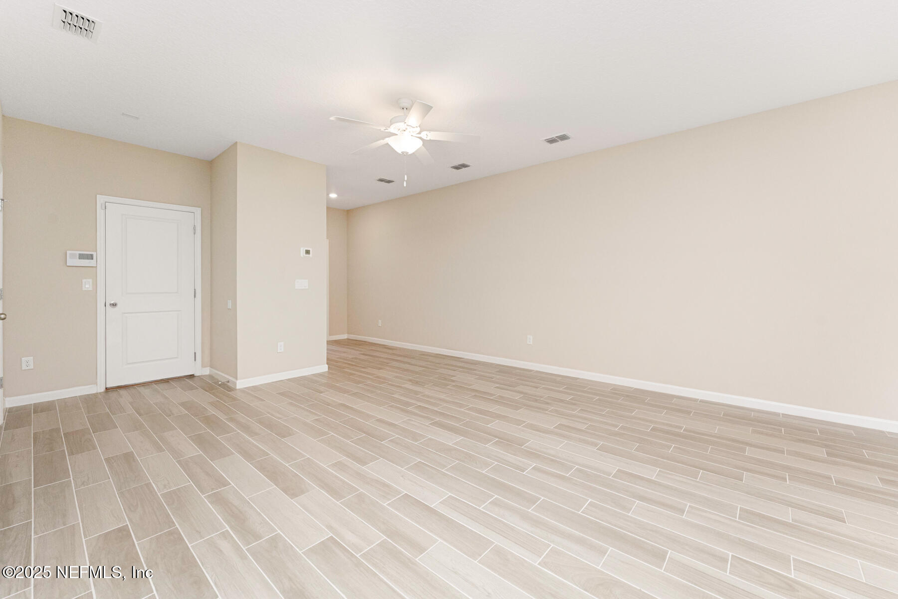 1171 Beach Dune Drive Jacksonville, FL 32233 - Photo 27 of 27 a view of an empty room with wooden floor