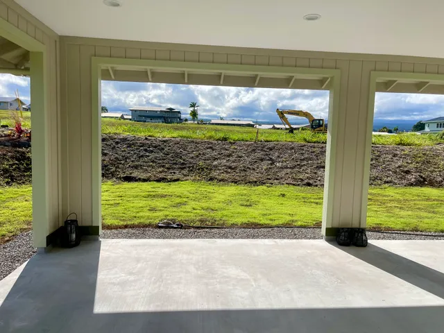 a view of a back yard from a room