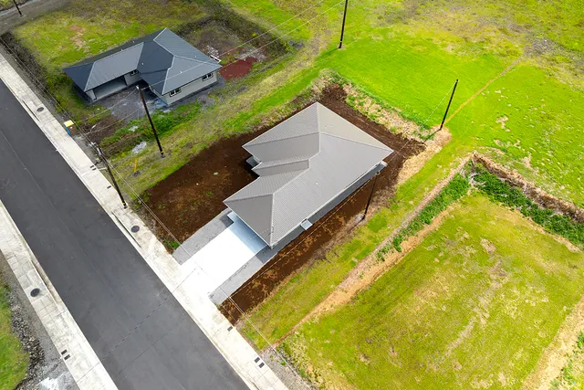 a view of a small pool with a yard