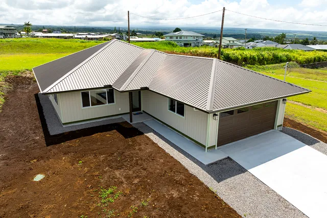 a aerial view of a house with swimming pool