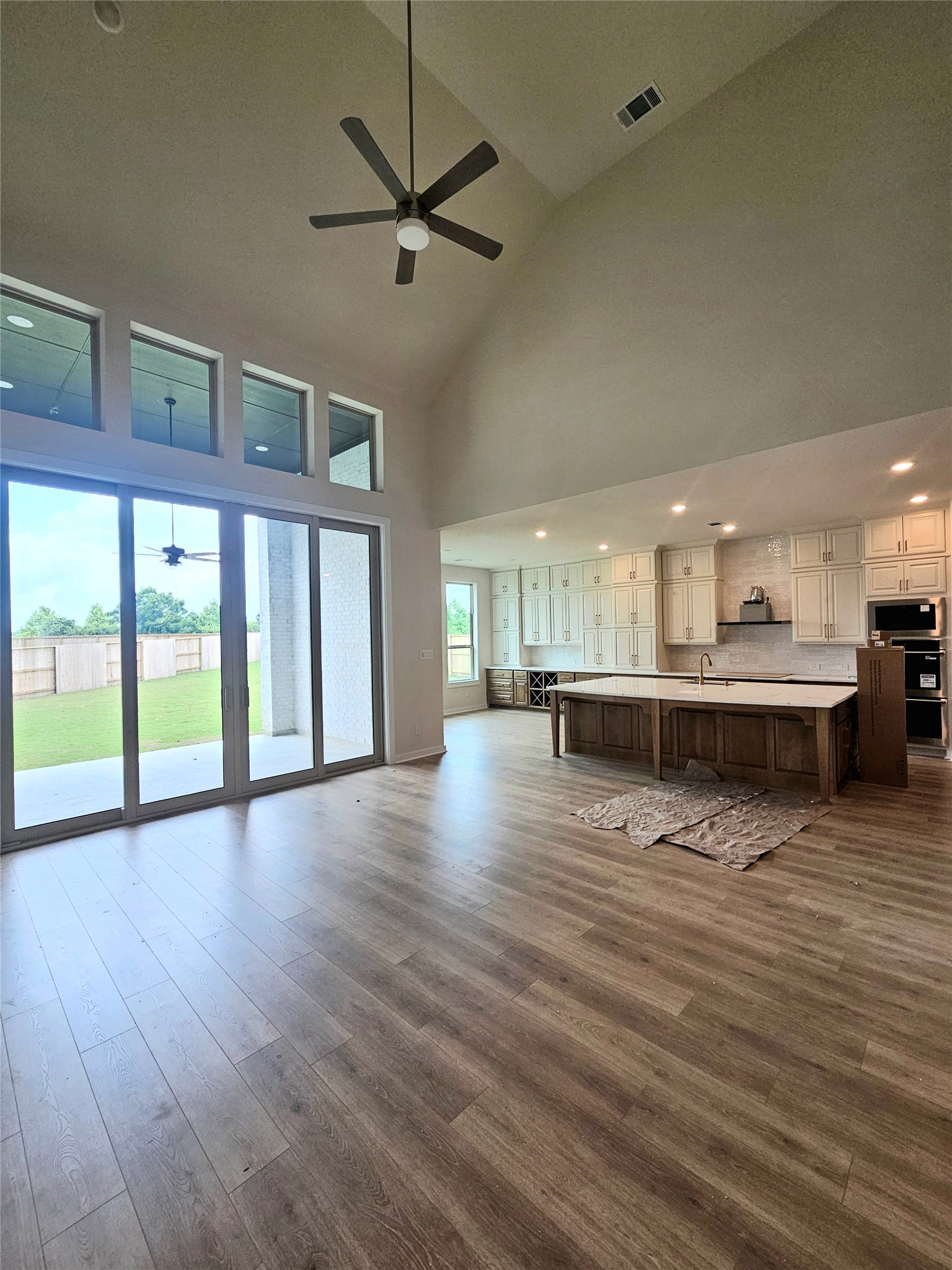 8701 Antelope Cyn Way Manvel, TX 77578 - Photo 5 of 32 a view of an empty room with a window and wooden floor