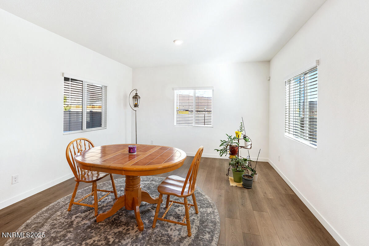 720 Butte Crk Road Dayton, NV 89403 - Photo 11 of 25 a dining room with furniture and wooden floor