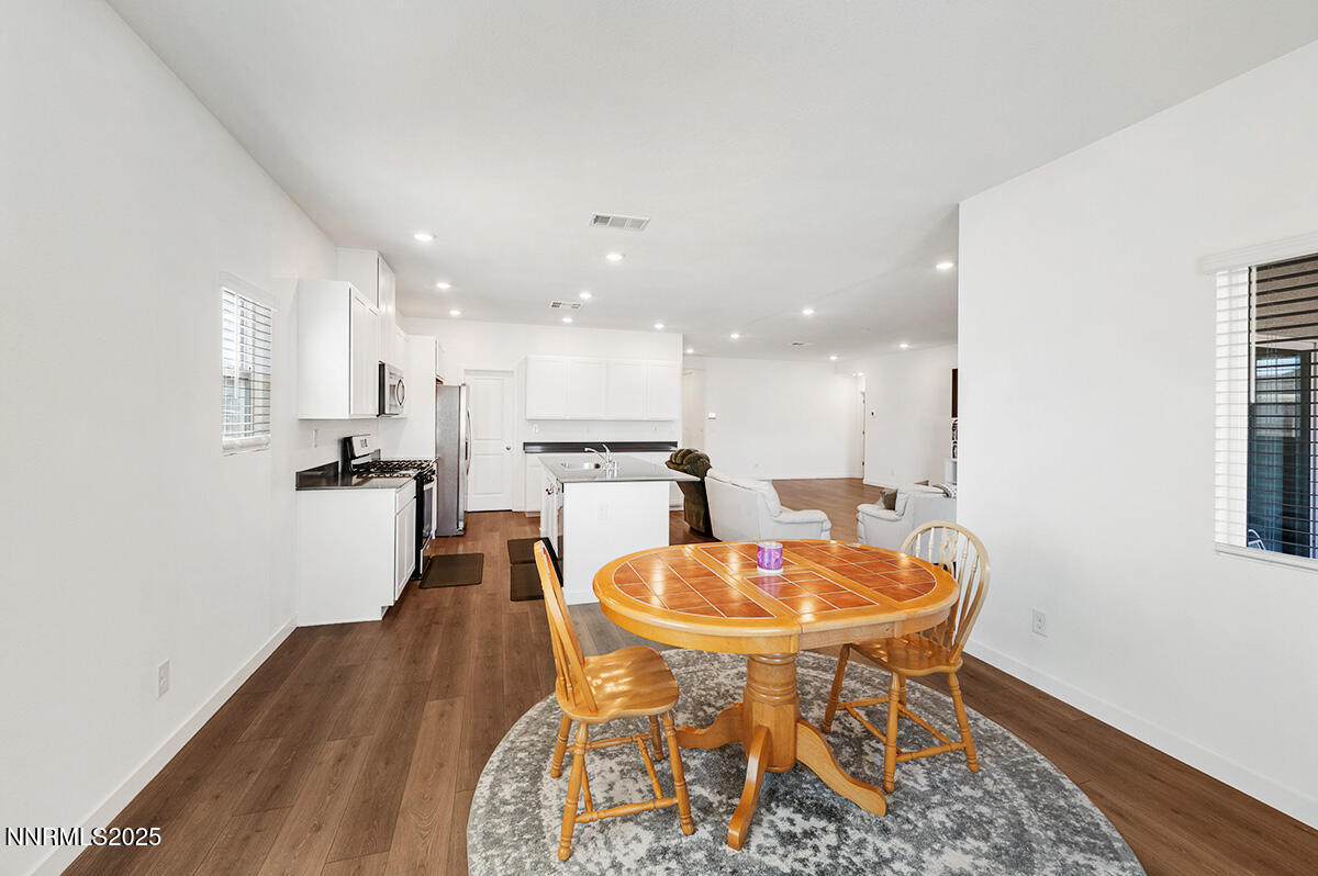 720 Butte Crk Road Dayton, NV 89403 - Photo 12 of 25 a dining room with furniture and a kitchen view