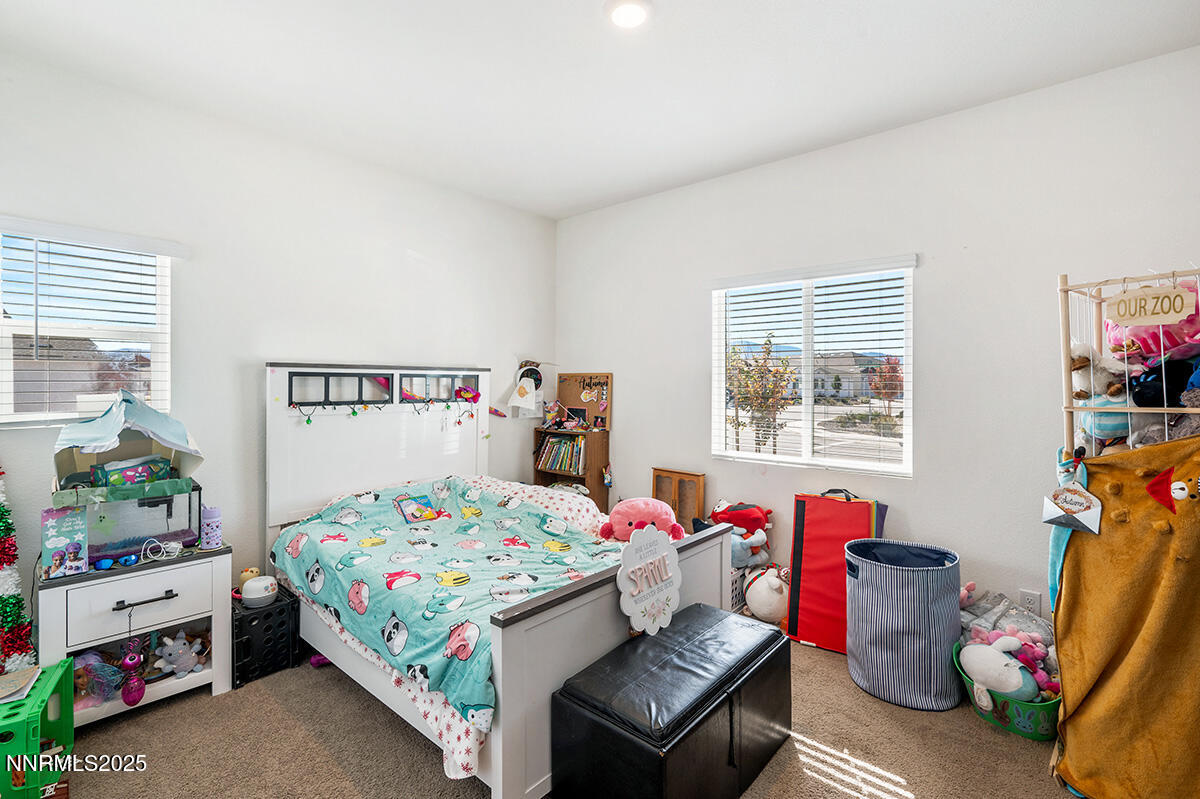 720 Butte Crk Road Dayton, NV 89403 - Photo 16 of 25 a bedroom with a bed and a window