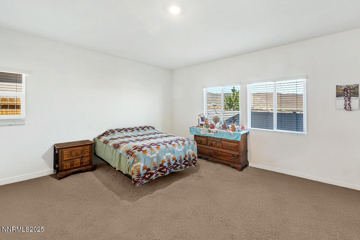 720 Butte Crk Road Dayton, NV 89403 - Photo 19 of 25 a bedroom with bed and a window