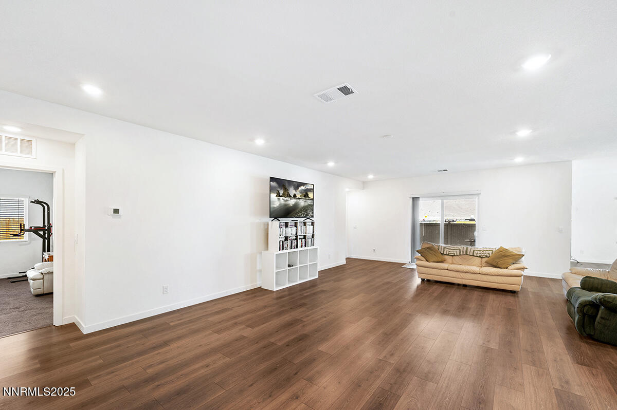 720 Butte Crk Road Dayton, NV 89403 - Photo 5 of 25 a view of a livingroom with wooden floor and a rug