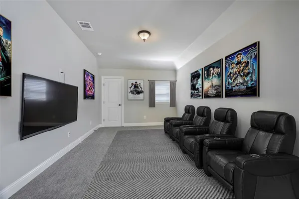 a room with lots of white furniture and window