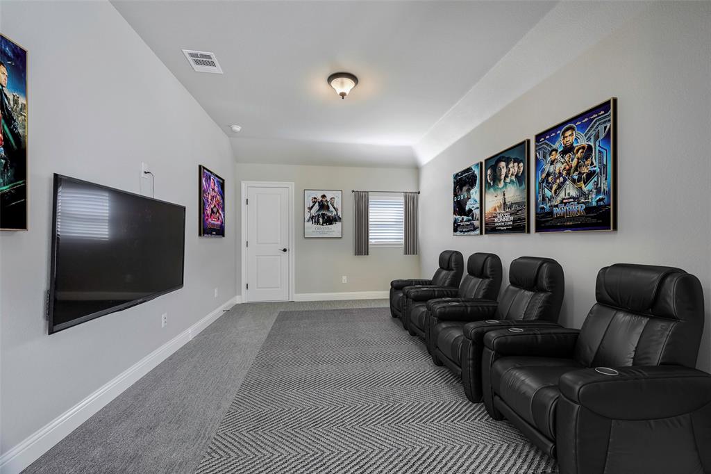 941 Leola Lane Allen, TX 75013 - Photo 24 of 37 a living room with furniture and a flat screen tv