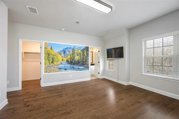 a view of an empty room with a window
