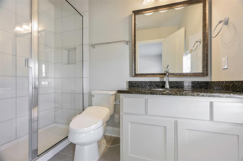 941 Leola Lane Allen, TX 75013 - Photo 27 of 37 a bathroom with a sink toilet and shower
