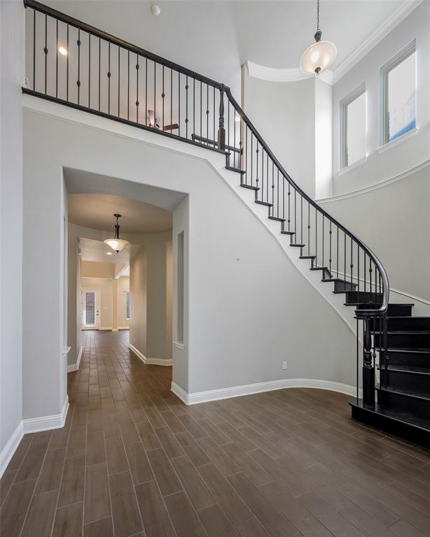 941 Leola Lane Allen, TX 75013 - Photo 5 of 37 a view of staircase with white walls and a window
