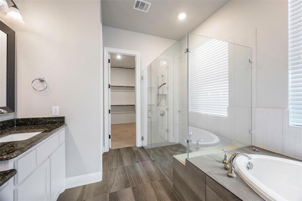 941 Leola Lane Allen, TX 75013 - Photo 8 of 37 a bathroom with a granite countertop sink and a bathtub