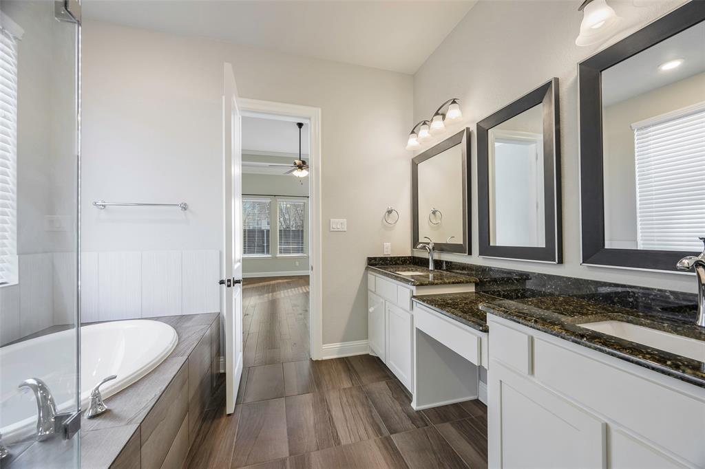 941 Leola Lane Allen, TX 75013 - Photo 9 of 37 a bathroom with a bathtub sink and mirror