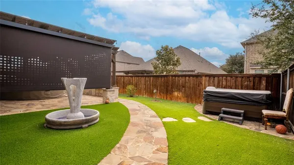 a view of house with yard outdoor seating and swimming pool